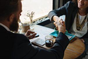 Two business people shaking hands. 